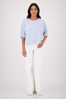 Monari light sky blue jersey top with a relaxed fit and short sleeves worn by a model