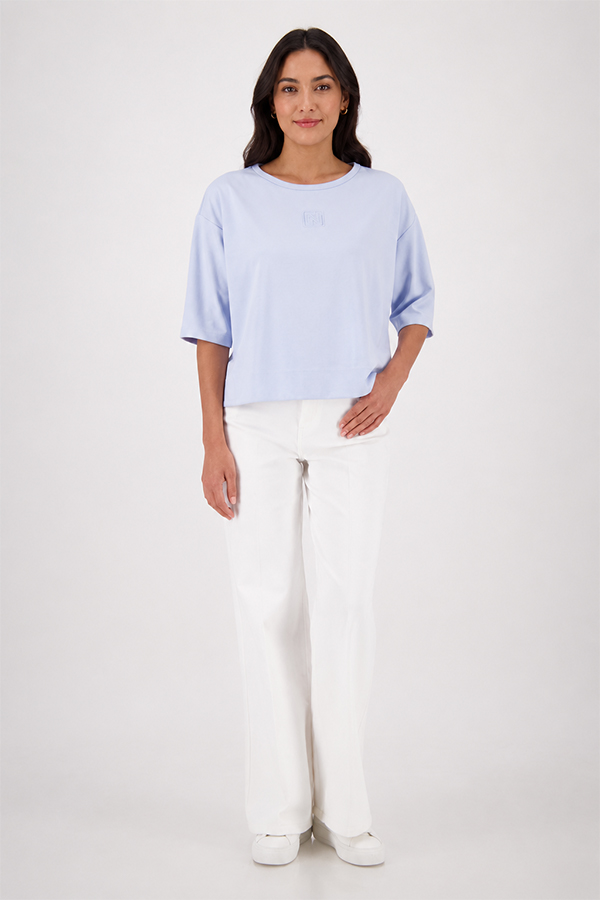 Monari light sky blue jersey top with a relaxed fit and short sleeves worn by a model