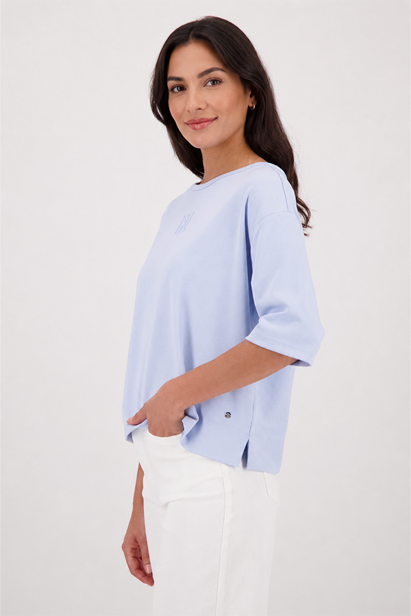 Monari light sky blue jersey top with a relaxed fit and short sleeves worn by a model