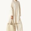 Ivory braided faux leather tote bag by Ilse Jacobsen