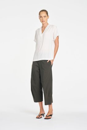 Mela Purdie Wedge Tab Shell in White front view featuring relaxed silhouette and V-neckline