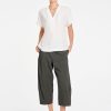 Mela Purdie Wedge Tab Shell in White front view featuring relaxed silhouette and V-neckline