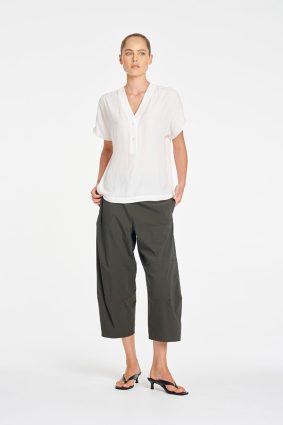 Mela Purdie Wedge Tab Shell in White front view featuring relaxed silhouette and V-neckline