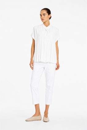 Mela Purdie Zip Tapered Pant in White front view showing streamlined silhouette and cropped length