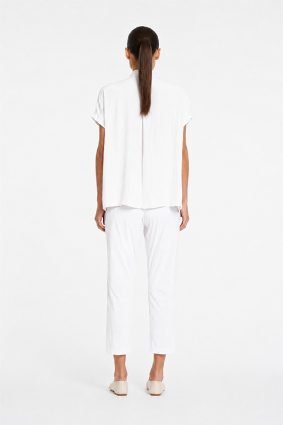 Mela Purdie Zip Tapered Pant in White front view showing streamlined silhouette and cropped length