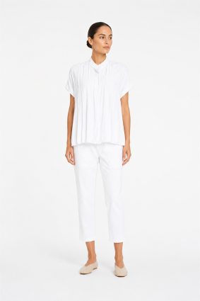 Mela Purdie Zip Tapered Pant in White front view showing streamlined silhouette and cropped length