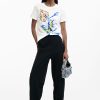 Desigual white short-sleeve tee with vibrant blue, yellow, and green floral print