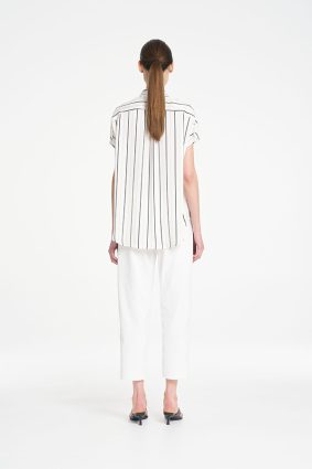 Mela Purdie Bow Pant in Ivory featuring a clean, cropped silhouette and sophisticated tailored design