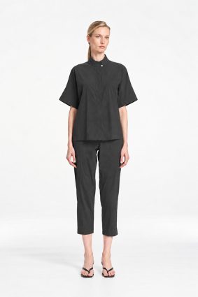Mela Purdie Tab Shell top in deep bark tone featuring a relaxed silhouette, stand collar, and short sleeves