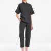 Mela Purdie Tab Shell top in deep bark tone featuring a relaxed silhouette, stand collar, and short sleeves