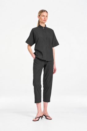 Mela Purdie Tab Shell top in deep bark tone featuring a relaxed silhouette, stand collar, and short sleeves