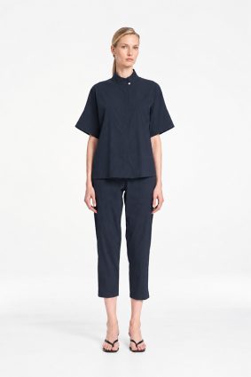 Mela Purdie Tab Shell top in classic French Navy featuring a relaxed silhouette, stand collar, and short sleeves