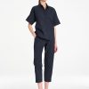 Mela Purdie Tab Shell top in classic French Navy featuring a relaxed silhouette, stand collar, and short sleeves