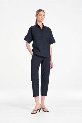 Mela Purdie Tab Shell top in classic French Navy featuring a relaxed silhouette, stand collar, and short sleeves