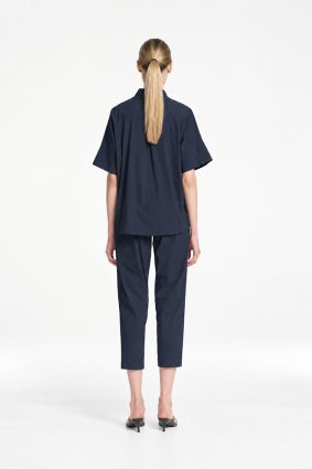 Mela Purdie Tab Shell top in classic French Navy featuring a relaxed silhouette, stand collar, and short sleeves