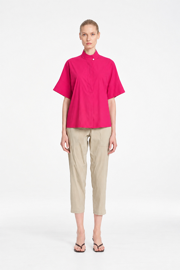 Mela Purdie Tab Shell top in vibrant raspberry featuring a relaxed silhouette, stand collar, and short sleeves