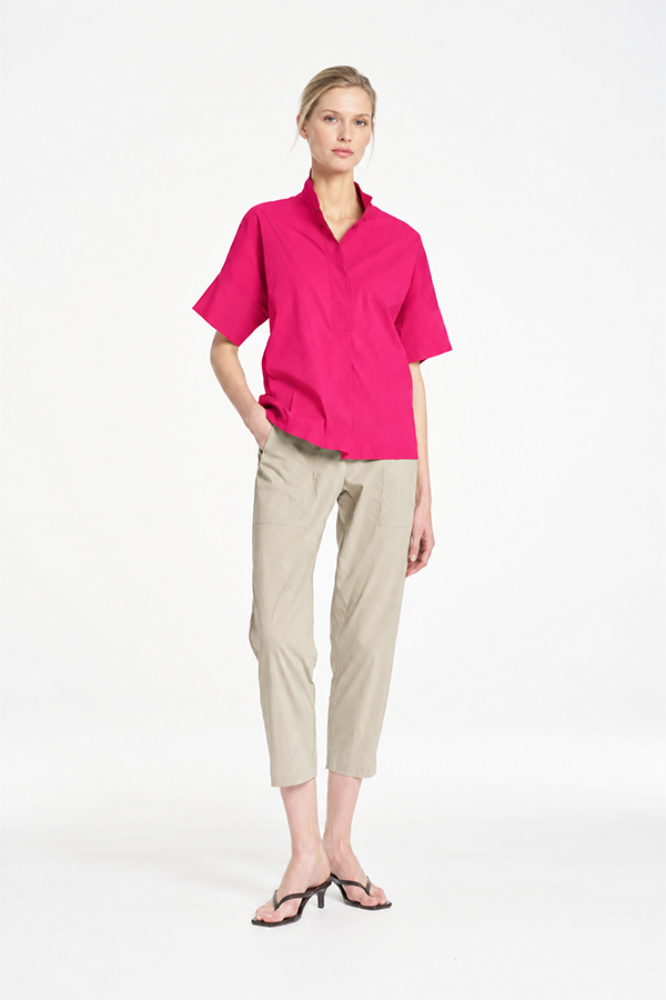 Mela Purdie Tab Shell top in vibrant raspberry featuring a relaxed silhouette, stand collar, and short sleeves