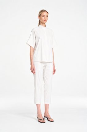 Mela Purdie Tab Shell top in crisp white featuring a relaxed silhouette, stand collar, and short sleeves