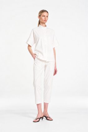 Mela Purdie Tab Shell top in crisp white featuring a relaxed silhouette, stand collar, and short sleeves