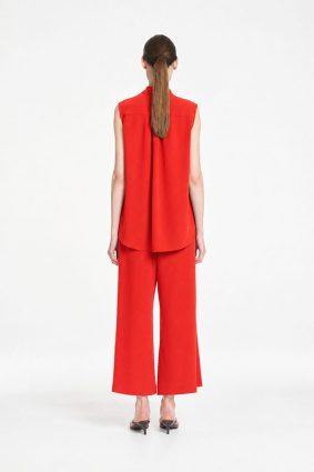 Mela Purdie Tabbard Tank in vibrant papaya featuring a sophisticated sleeveless style, relaxed fluid silhouette, stand collar, and open neckline
