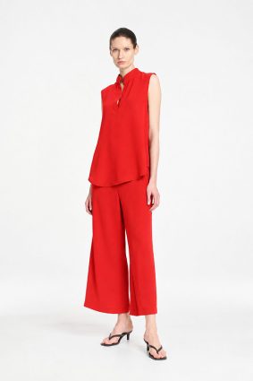 Mela Purdie Tabbard Tank in vibrant papaya featuring a sophisticated sleeveless style, relaxed fluid silhouette, stand collar, and open neckline