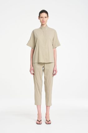 Mela Purdie Zip Tapered Pant in soft seagrass featuring a clean, tailored silhouette, practical front pockets, and a relaxed cropped fit