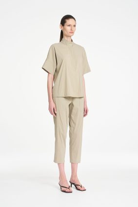 Mela Purdie Zip Tapered Pant in soft seagrass featuring a clean, tailored silhouette, practical front pockets, and a relaxed cropped fit