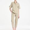 Mela Purdie Zip Tapered Pant in soft seagrass featuring a clean, tailored silhouette, practical front pockets, and a relaxed cropped fit