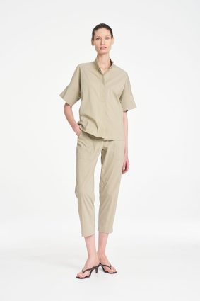 Mela Purdie Zip Tapered Pant in soft seagrass featuring a clean, tailored silhouette, practical front pockets, and a relaxed cropped fit