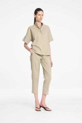 Mela Purdie Zip Tapered Pant in soft seagrass featuring a clean, tailored silhouette, practical front pockets, and a relaxed cropped fit