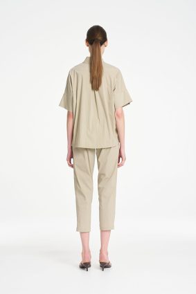 Mela Purdie Zip Tapered Pant in soft seagrass featuring a clean, tailored silhouette, practical front pockets, and a relaxed cropped fit