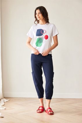 Peruzzi Circle Print T Shirt White featuring a colourful abstract navy, green, and red circle print against a white base.