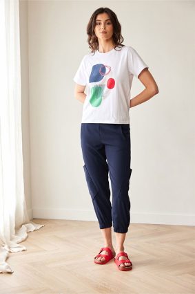 Peruzzi Circle Print T Shirt White featuring a colourful abstract navy, green, and red circle print against a white base.