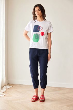 Peruzzi Circle Print T Shirt White featuring a colourful abstract navy, green, and red circle print against a white base.
