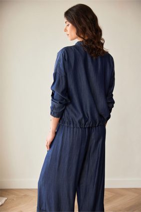 Peruzzi Luxe Jean Jacket Denim featuring a relaxed silhouette in a rich indigo denim look, finished with statement buttons and subtle pocket detailing.