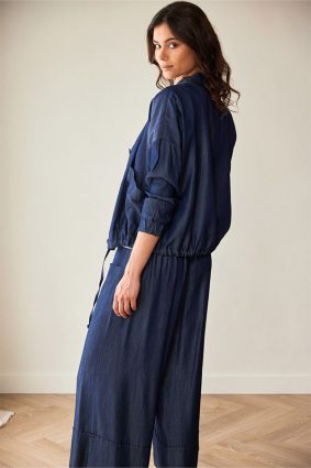 Peruzzi Luxe Jean Jacket Denim featuring a relaxed silhouette in a rich indigo denim look, finished with statement buttons and subtle pocket detailing.