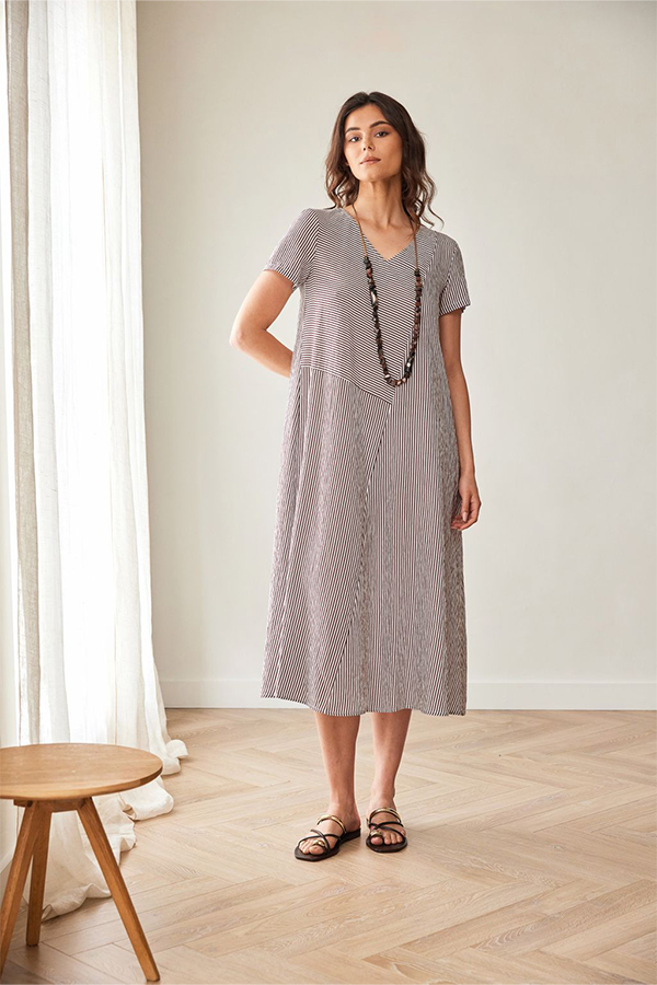 Peruzzi Stripe Dress Brn/Ecru featuring a fine brown and ecru stripe pattern with contrasting stripe directions, short sleeves, and a V-neckline in a relaxed midi length.