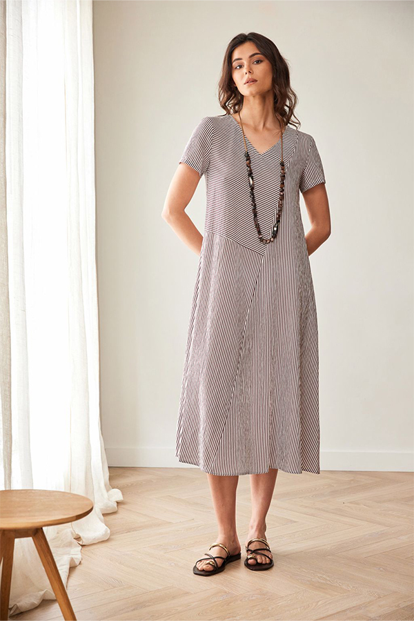 Peruzzi Stripe Dress Brn/Ecru featuring a fine brown and ecru stripe pattern with contrasting stripe directions, short sleeves, and a V-neckline in a relaxed midi length.