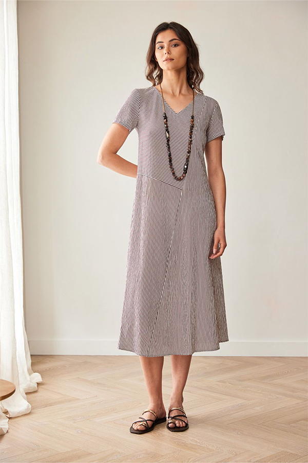 Peruzzi Stripe Dress Brn/Ecru featuring a fine brown and ecru stripe pattern with contrasting stripe directions, short sleeves, and a V-neckline in a relaxed midi length.