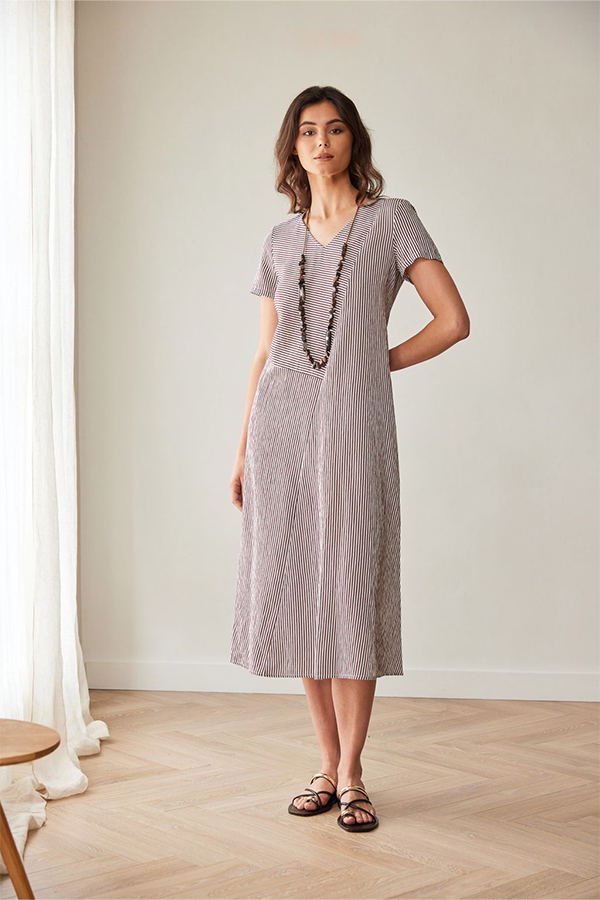 Peruzzi Stripe Dress Brn/Ecru featuring a fine brown and ecru stripe pattern with contrasting stripe directions, short sleeves, and a V-neckline in a relaxed midi length.