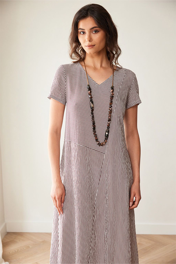 Peruzzi Stripe Dress Brn/Ecru featuring a fine brown and ecru stripe pattern with contrasting stripe directions, short sleeves, and a V-neckline in a relaxed midi length.