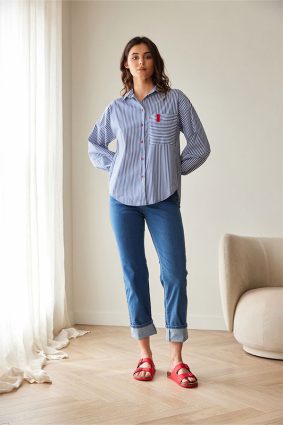 Peruzzi Stripe Shirt Navy/White featuring a crisp navy and white stripe with contrasting stripe direction on the front pocket and cuffs, finished with red button detailing and a relaxed silhouette.