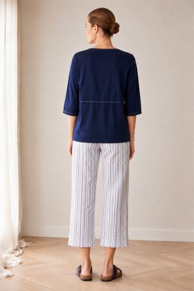 Peruzzi Stripe Trouser Navy featuring a fresh navy and white vertical stripe with a flattering cropped, wide-leg silhouette and statement turn-up cuffs.