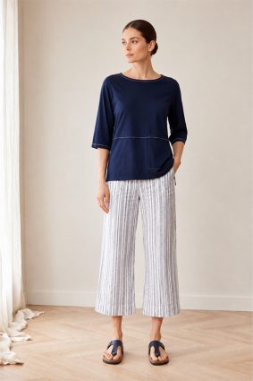 Peruzzi Stripe Trouser Navy featuring a fresh navy and white vertical stripe with a flattering cropped, wide-leg silhouette and statement turn-up cuffs.