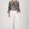 Monari leopard print blouse in coffee, black and cream tones with round neckline and ruffle cuffs